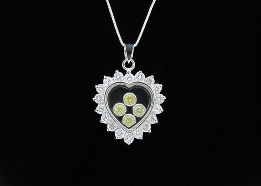 Sunshine - Pendentif en forme de cœur en argent sterling avec bordure en zircone cubique transparent et zircones cubiques flottantes jaunes sur une chaîne en argent sterling